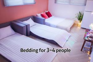Postel nebo postele na pokoji v ubytování Hostel Mihojae Seomyeon