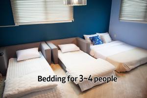 Postel nebo postele na pokoji v ubytování Hostel Mihojae Seomyeon