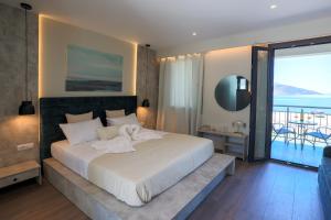 Posteľ alebo postele v izbe v ubytovaní SAMI BEACHVIEW