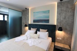 Posteľ alebo postele v izbe v ubytovaní SAMI BEACHVIEW