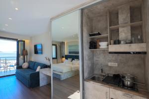 Posteľ alebo postele v izbe v ubytovaní SAMI BEACHVIEW