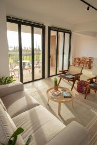 a living room with a couch and a table at mhouse44 in Peyia