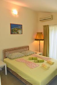 Ένα ή περισσότερα κρεβάτια σε δωμάτιο στο Riverside Apartments Chiara