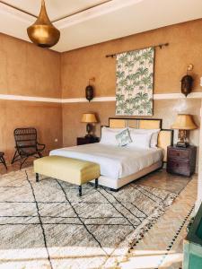 a bedroom with a large bed and a rug at The Levantine in Marrakesh