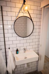 a bathroom with a sink and a mirror at mhouse44 in Peyia +49 photos