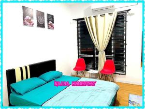 เตียงในห้องที่ Naira Homestay Kota Bharu ,Wakaf Che Yeh 4 Bilik 3 Aircond