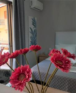 A bed or beds in a room at Nini's House 2 - 100m from beach NIDRI TOWN CENTER