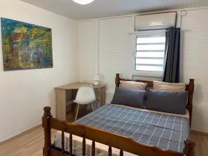 Voodi või voodid majutusasutuse Villa Anse Mitan toas