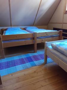 a room with two bunk beds in a tent at U včelárov in Mýto pod Ďumbierom