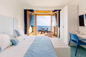 Posteľ alebo postele v izbe v ubytovaní Sea View Ravello