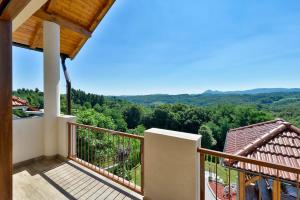 a balcony of a house with a view of the mountains at Holiday home _Oasis of peace_ Varaždin in Ivanec