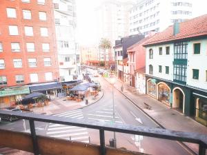 a view of a street in a city with buildings at EL DESCANSO DE CARBAYEDO in Avilés