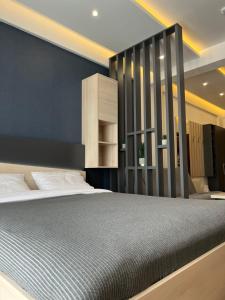 a bedroom with a large bed in a room at PresidentKop LUX Wellness & SPA Apartments in Kopaonik +48 photos