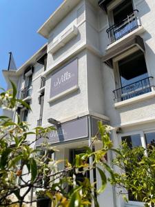 a building with a sign on the side of it at Hôtel La Villa Cannes in Cannes