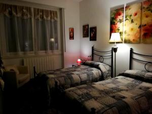 Postel nebo postele na pokoji v ubytování B&B Rosa