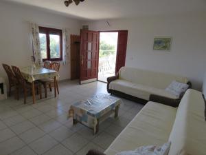 a living room with a couch and a table at Apartman Vir Gogo br 5 in Vir