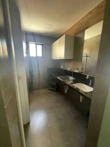 a bathroom with two sinks and a large mirror at Ilusion flat Ponta Negra in Natal +12 photos