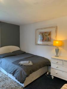 A bed or beds in a room at Garden Studio in the Ribble Valley