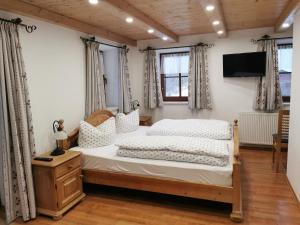 Postel nebo postele na pokoji v ubytování Gästehaus Obersulzberglehen