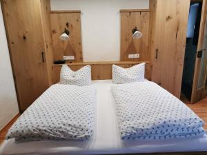 Postel nebo postele na pokoji v ubytování Gästehaus Obersulzberglehen