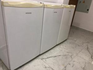 two white washing machines sitting next to each other at NR1 HOTEL in Çanakkale