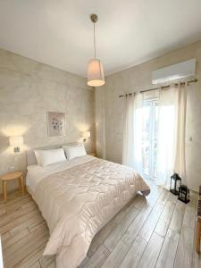 Postel nebo postele na pokoji v ubytování Maisonette Pylos