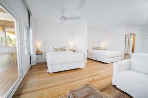 Katil atau katil-katil dalam bilik di The Beach House Boutique Hotel