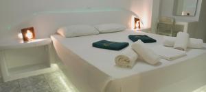 A bed or beds in a room at Leros Eleonas Apartments