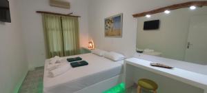 A bed or beds in a room at Leros Eleonas Apartments
