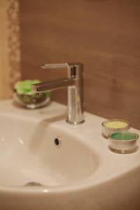 a sink with a faucet on top of it at B&B Pozzorosso in Vasto