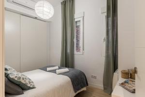 Ein Bett oder Betten in einem Zimmer der Unterkunft Waou Chamberi V - Alquiler Corta Duración
