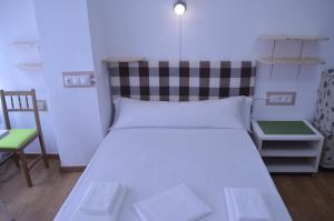 Posteľ alebo postele v izbe v ubytovaní ArArAt Hostel