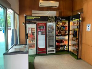 a store with two refrigerators in a store at Flat com Ótima infraestrutura in Rio de Janeiro