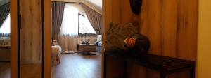 a hallway with a room with a bedroom and a window at PinePino Borovets, aparthotel Borovets Gardens A60 in Borovets