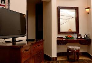 A television and/or entertainment center at Ocean Paradise Resort & Spa