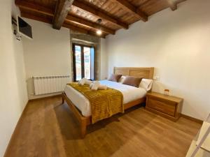 En eller flere senge i et værelse på Casa do Veiga
