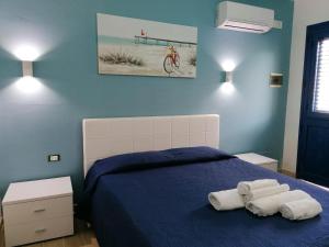Postel nebo postele na pokoji v ubytování B&B Santorini