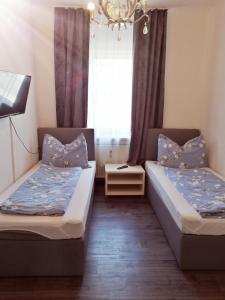 Łóżko lub łóżka w pokoju w obiekcie Betterhome Apartments am Stadion I Free Parking I Self Check-in