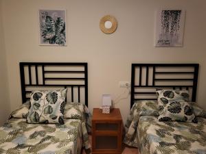 A bed or beds in a room at Apartamento exótico en primera línea de Vera-Playa!