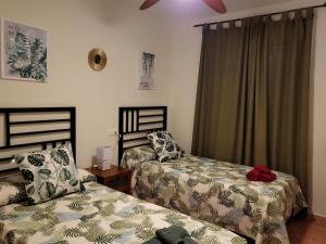 A bed or beds in a room at Apartamento exótico en primera línea de Vera-Playa!