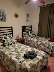 A bed or beds in a room at Apartamento exótico en primera línea de Vera-Playa!