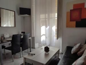 a living room with a couch and a table at Principe A in Granada