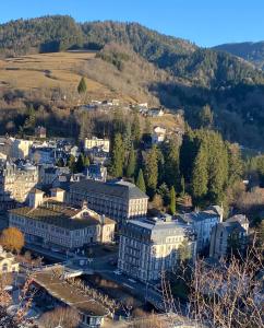 an aerial view of a city with buildings and trees at Grand appartement hyper centre haut standing in La Bourboule