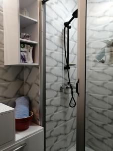 a shower with a glass door in a bathroom at Ryan 1 in Fès