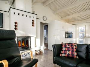 a living room with a couch and a fireplace at Six-Bedroom Holiday home in Humble in Humble