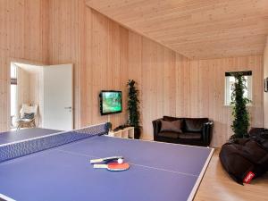 a room with a ping pong table in it at 16 person holiday home in Tisvildeleje in Tisvildeleje