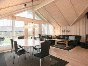 a living room with a table and a couch at 6 person holiday home in Vinderup in Vinderup