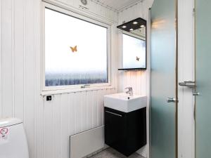 a bathroom with a sink and a window at 6 person holiday home in Vinderup in Vinderup