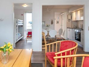 a kitchen and dining room with a table and chairs at Seaside Retreat at Rim - By Traum Ferienwohnungen in Rømø Kirkeby
