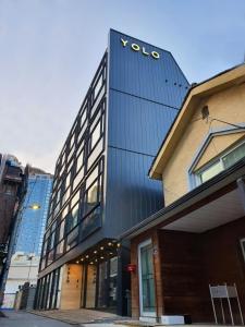 a building with a vodota sign on the side of it at YOLO Guesthouse in Seoul